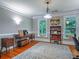 Bright home office featuring hardwood floors, a patterned rug, and vintage décor at 1820 Walker Sw Rd, Conyers, GA 30094