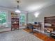 Bright home office featuring hardwood floors, vintage bookcases, and bright windows at 1820 Walker Sw Rd, Conyers, GA 30094