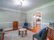 Cozy living room featuring hardwood floors, classic moldings, and neutral paint at 1820 Walker Sw Rd, Conyers, GA 30094