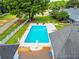 Backyard pool with diving board and lounge chairs surrounded by a white fence at 1820 Walker Sw Rd, Conyers, GA 30094