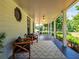 Relaxing porch featuring a stylish rug, comfortable seating, and picturesque views of the surrounding greenery at 1820 Walker Sw Rd, Conyers, GA 30094