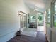 Enclosed porch featuring white shiplap walls and a ceiling fan provides a cool relaxation area at 1820 Walker Sw Rd, Conyers, GA 30094