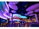 Vibrant interior of the Georgia Aquarium with unique lighting and crowds of visitors at 3292 Lions Ruby Ln, Atlanta, GA 30349