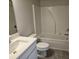 Clean bathroom featuring a shower and tub combo, toilet, sink and vanity at 3292 Lions Ruby Ln, Atlanta, GA 30349