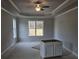 Spacious bedroom with a ceiling fan and tray ceiling design at 3292 Lions Ruby Ln, Atlanta, GA 30349