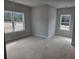 Spacious bedroom featuring two large windows that offer natural light and street views at 3292 Lions Ruby Ln, Atlanta, GA 30349