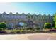 Exterior of the Fernbank Museum featuring dinosaur sculptures, landscaping, and building facade at 3292 Lions Ruby Ln, Atlanta, GA 30349