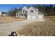 Beautiful home with gray siding, black shutters, large driveway and a two-car garage at 3292 Lions Ruby Ln, Atlanta, GA 30349