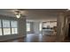 Spacious living room with wood floors, fireplace, ceiling fan and an open concept design at 3292 Lions Ruby Ln, Atlanta, GA 30349