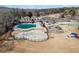 Aerial view of the community center, splash pad, playground and sport court at 3377 Fielders Pt, Dacula, GA 30019