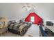 This bedroom features two twin beds with a bright red accent wall at 3377 Fielders Pt, Dacula, GA 30019