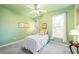 Cozy bedroom with neutral carpet, green walls and a ceiling fan at 3377 Fielders Pt, Dacula, GA 30019