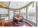 Eat-in dining area features hardwood floors, decorative lighting, and large windows at 3377 Fielders Point, Dacula, GA 30019