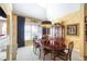 Elegant dining room featuring a chandelier, dark wood table, and natural light at 3377 Fielders Point, Dacula, GA 30019