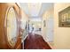 Inviting home foyer featuring hardwood floors, chandelier and decorative console table at 3377 Fielders Pt, Dacula, GA 30019