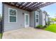 Private back patio with grey siding and white door at 601 Cork St, Woodstock, GA 30188