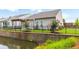 Backyard view with pond, fence, and retaining wall at 601 Cork St, Woodstock, GA 30188