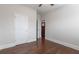 Hardwood floor bedroom with ceiling fan and access to hallway at 601 Cork St, Woodstock, GA 30188