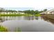 Peaceful community pond with houses and lush green trees at 601 Cork St, Woodstock, GA 30188