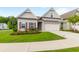 Two-story house with a two car garage and manicured lawn at 601 Cork St, Woodstock, GA 30188
