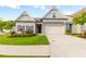 Brick home with 2-car garage, landscaping, and a welcoming front porch at 601 Cork St, Woodstock, GA 30188