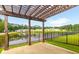 Relaxing patio area with pergola offering lake and community views at 601 Cork St, Woodstock, GA 30188