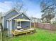 View of the house from the backyard with a deck featuring a sunshade at 601 Formwalt Sw St, Atlanta, GA 30312