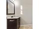 Bathroom featuring a vanity with storage, decorative mirror and updated fixtures at 601 Formwalt Sw St, Atlanta, GA 30312