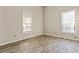 Bedroom featuring two windows for natural light and updated flooring at 601 Formwalt Sw St, Atlanta, GA 30312