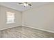 Bedroom with ceiling fan, a window for natural light, and updated flooring at 601 Formwalt Sw St, Atlanta, GA 30312