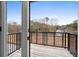 Private deck with wooded views and a metal railing at 1076 Brookglynn Trce, Decatur, GA 30032