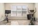 Bright home gym with window and space for exercise equipment at 3709 Northsails Ct, Conyers, GA 30013