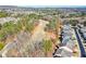 Residential neighborhood near a golf course showcasing well-kept homes, mature trees, and community atmosphere at 221 Aster Ct, Canton, GA 30114