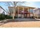 Inviting backyard featuring a covered patio and balcony, perfect for outdoor entertaining and relaxation at 221 Aster Ct, Canton, GA 30114