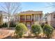 Beautiful home featuring a manicured backyard with lush greenery and a charming outdoor space at 221 Aster Ct, Canton, GA 30114