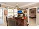 Finished basement bar featuring a wooden counter, mini-fridge, and sports memorabilia at 221 Aster Ct, Canton, GA 30114