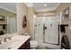 Bathroom featuring a glass-enclosed shower, vanity with sink, and tiled floors at 221 Aster Ct, Canton, GA 30114