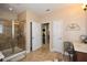 Bathroom featuring a glass-enclosed shower and a view into the walk-in closet at 221 Aster Ct, Canton, GA 30114