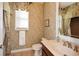 Bathroom with floral wallpaper, a vanity sink, and a window with curtains at 221 Aster Ct, Canton, GA 30114