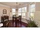 Bright breakfast nook with shuttered windows and an ornamental hanging light fixture at 221 Aster Ct, Canton, GA 30114