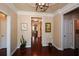 Bright foyer featuring hardwood floors and an open view into the home's living spaces at 221 Aster Ct, Canton, GA 30114