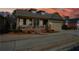 Single-Gathering home with front porch, set against a sunset sky at 221 Aster Ct, Canton, GA 30114