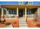 Inviting front porch features a swing, comfortable seating, and classic architectural columns at 221 Aster Ct, Canton, GA 30114