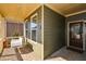 Charming front porch with a swing, neutral tones, and a welcoming entrance at 221 Aster Ct, Canton, GA 30114