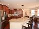 Kitchen featuring a large breakfast bar, stainless appliances, and modern pendant lighting at 221 Aster Ct, Canton, GA 30114