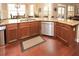 Kitchen with breakfast bar, stainless steel dishwasher and view to breakfast nook at 221 Aster Ct, Canton, GA 30114