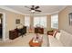 Comfortable room with two desks, a futon, carpet, and a ceiling fan at 221 Aster Ct, Canton, GA 30114