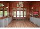 Grand lobby entrance featuring stained glass details, wood paneled walls, and stylish console tables at 221 Aster Ct, Canton, GA 30114