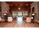 Elegant lounge area with stone fireplace, wood accents, comfortable seating, and abundant natural light at 221 Aster Ct, Canton, GA 30114