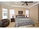 Comfortable bedroom offers a spacious layout, cozy seating, and plenty of natural light at 221 Aster Ct, Canton, GA 30114